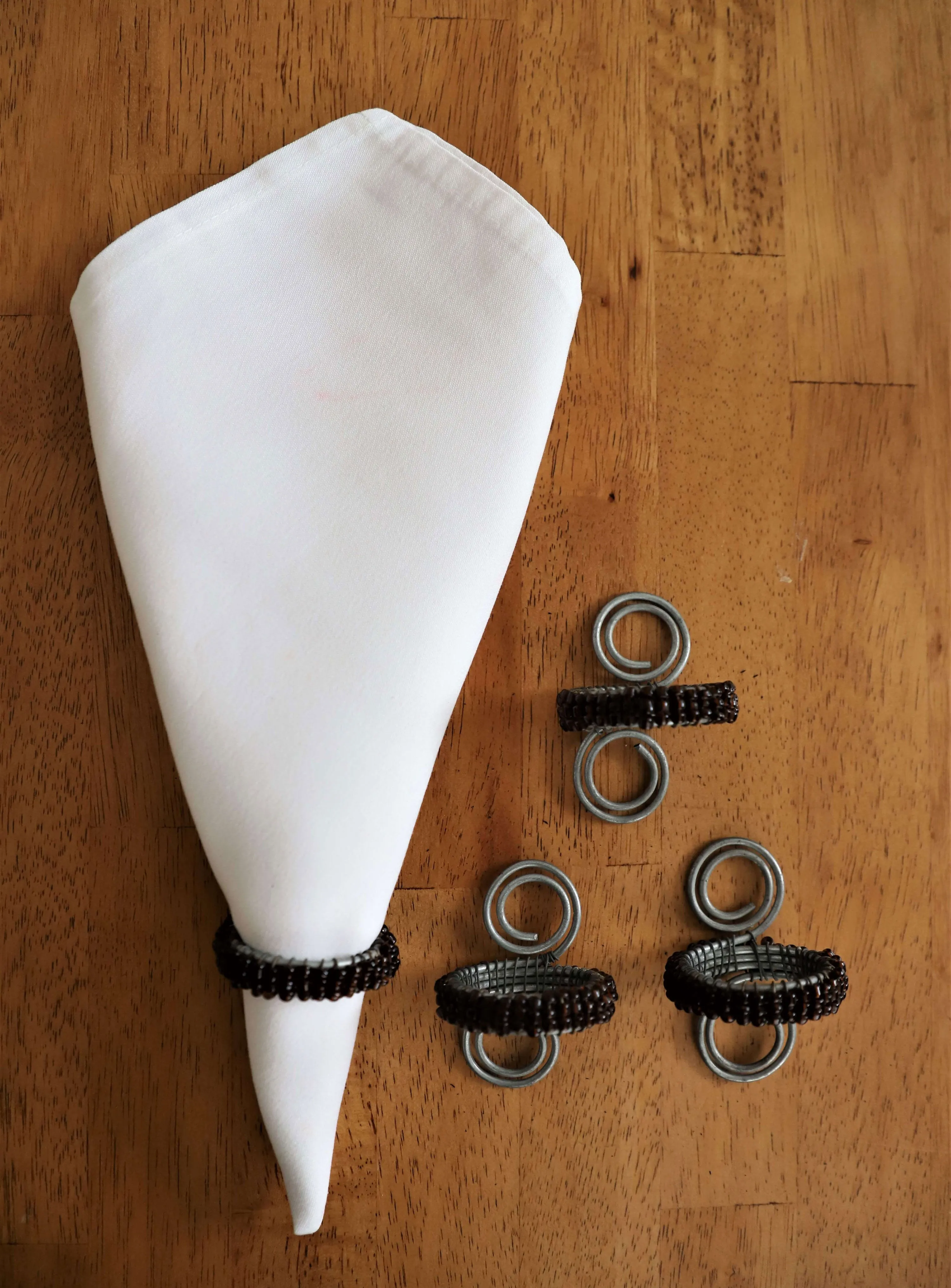 Beaded Brown & Cream Napkin Rings on aluminium stand | Handmade in Tanzania